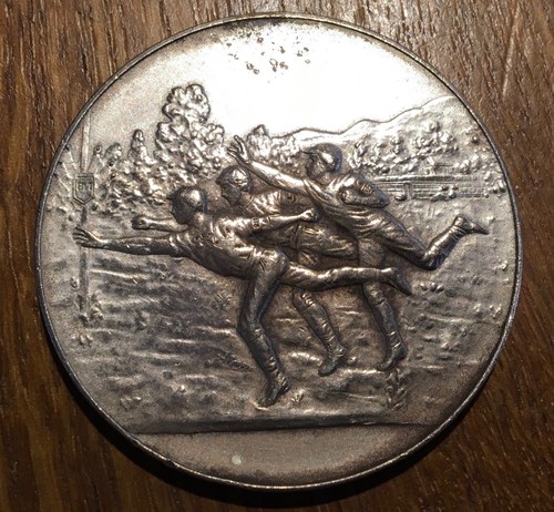 Medaille course identifier - À,