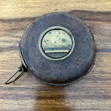 Ancien mètre ruban / décamètre en laiton et cuir ruban en tissu