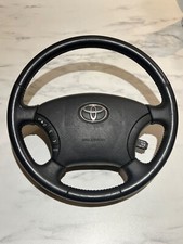 Volant Toyota Land Cruiser Séries HDJ, UZJ LC 100 noir de 02-07  TRÈS BON ÉTAT