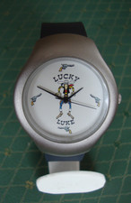 Montre -LUCKY LUKE- boitier nickel forme ovale verre rond Mt à quartz