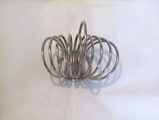 Petit porte-toasts à 8 emplacements en métal argenté TBE