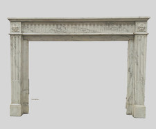 cheminée  louis XVI à rehaut en marbre massif décor à cannelure  . XX siècle .