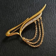 Broche stylisée chaînettes