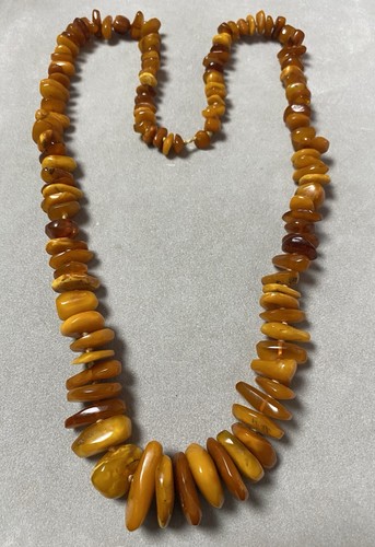 Collier perles ambre - en,