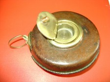 Ancien Décamètre bronze et Cuir , Ruban tissu , Diamètre 10 cm, bon état