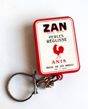 Ancien Porte Cle Publicité Boite Zan perles Réglisse ANIS