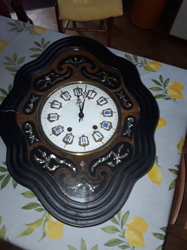 Horloge oeil boeuf avec - de,