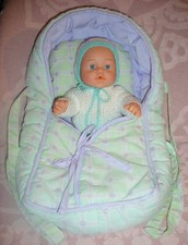 poupon corps dur de 30 cm avec couffin