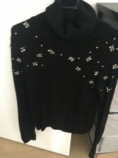 Pull col roulé noir avec