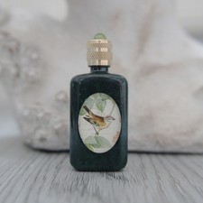 Miniature vide, bouteille en verre marbrée vert décoré d'un oiseau
