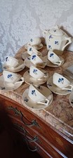 10 Tasses Et Soucoupes Et 1 Sucrier En Faience Aux Bleuets