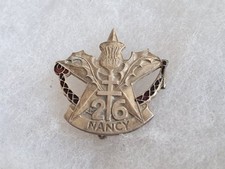 Un insigne militaire " 26° RI / 26° Régiment d'Infanterie / Nancy ".