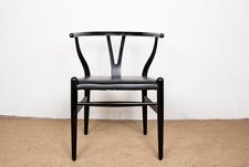 4 chaises danoises, en bois laqué noir et cuir, modèle CH 24 par Hans Wegner.