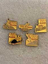 Pin’s X 5 Jo Jeux Olympiques Kodak Logo Mascotte Sport D’hiver Bobsleigh Ski..