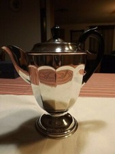 Sheffield rare verseuse de forme balustre à pans. Métal argenté et anse en ébène