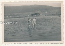Vintage photo - 2 pretty young woman in swimsuit bathing in a lake