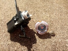 jouet Toupie beyblade L-Drago avec pointe métal + lanceur horaire + antihoraire