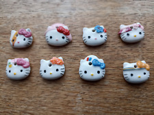 fève  hello kitty pendentif