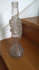 bouteille ancienne à sujet les trois têtes