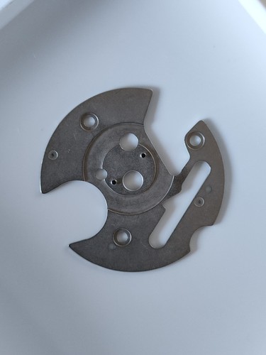 Date indicator hold plate - date,