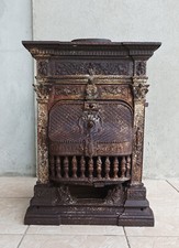 Poêle à bois ou charbon en fonte à décor d'angelots