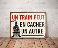 Plaque métal vintage citation un train peut en cacher un autre Décoration Gare