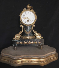 horloge pendule bronze louis XVI decor d'oiseaux
