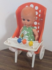 poupon dans sa chaise haute, vama made in italy, poupée