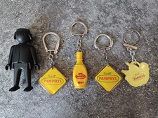E0 045 – Jus de fruits PAMPRYL - Lot de 4 porte clés PAMPRYL.