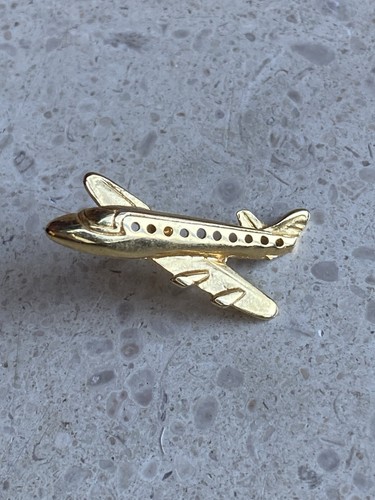 Pin avion doré - pin’s,