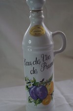 Bouteille en porcelaine eau de vie (prune) Signé Revol - 50 cl