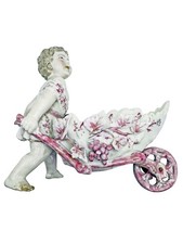 Figurine ancienne : Enfant à la brouette – céramique peinte. Bibelot de vitrine