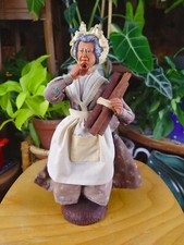 Ancien santon Speirano, femme, baton de canelle, corne de brume, tablier