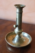 bougeoir flambeau a poussoir en laiton