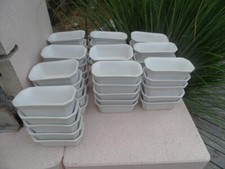 50 anciennes terrines en faience blanche de marque FP.23 elles sont neuves. 