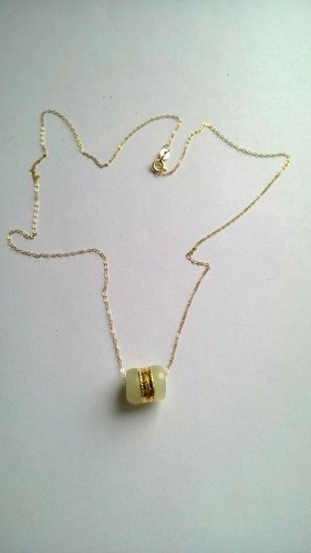 Collier neuf jaune - or,