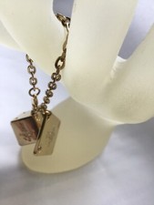 Bijou de sac dé et plaque 1