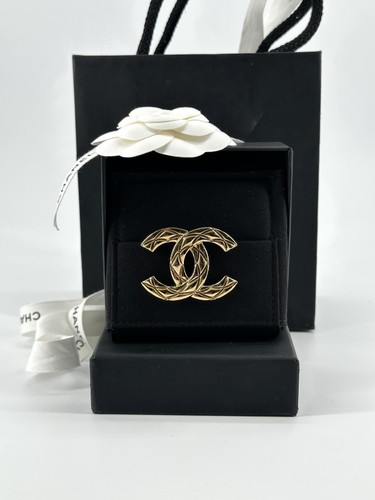 Broche chanel dorée - chanel,