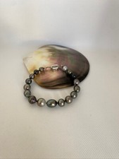 bracelet perle de culture de tahiti cerclee b fermoir argent 925 .