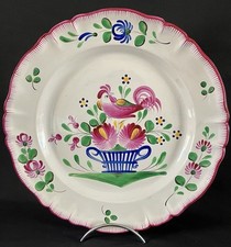 Grande assiette en faïence de l’Est décor oiseau stylisé et panier XVIIIème