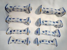 8 porte-couteaux en faïence