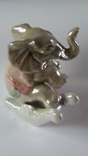 Petit Elephant En Faience. Hauteur 8 Cm. largeur 8 Cm.