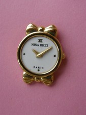 pin's montre NINA RICCI -  signé ARTHUS BERTRAND PARIS