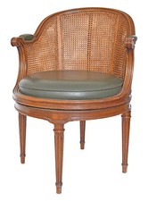 Fauteuil de bureau canné à l'assise tournante de style Louis XVI