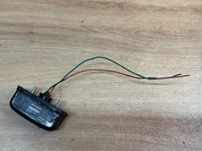 UN FEU DE PLAQUE ARRIERE BAVETTE ECLAIRAGE STANLEY P2707 / 50R-000712 MOTO HONDA