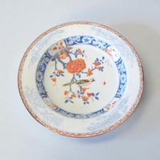 Chine. Compagnie des Indes. Assiette creuse porcelaine décor fleurs oiseau XVIII