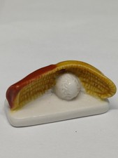 (E) Fève gant de pelote