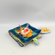Doudou livre d'éveil lion