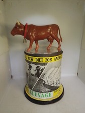 ANCIENNE BOITE PUBLICITAIRE DE POLY CLACIUM DECOR VACHE AVEC BOITRE A MUSIQUE