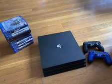 Sony PlayStation 4 Pro 1To Console de Jeu - Jet Black + 3 Manettes + 13 Jeux